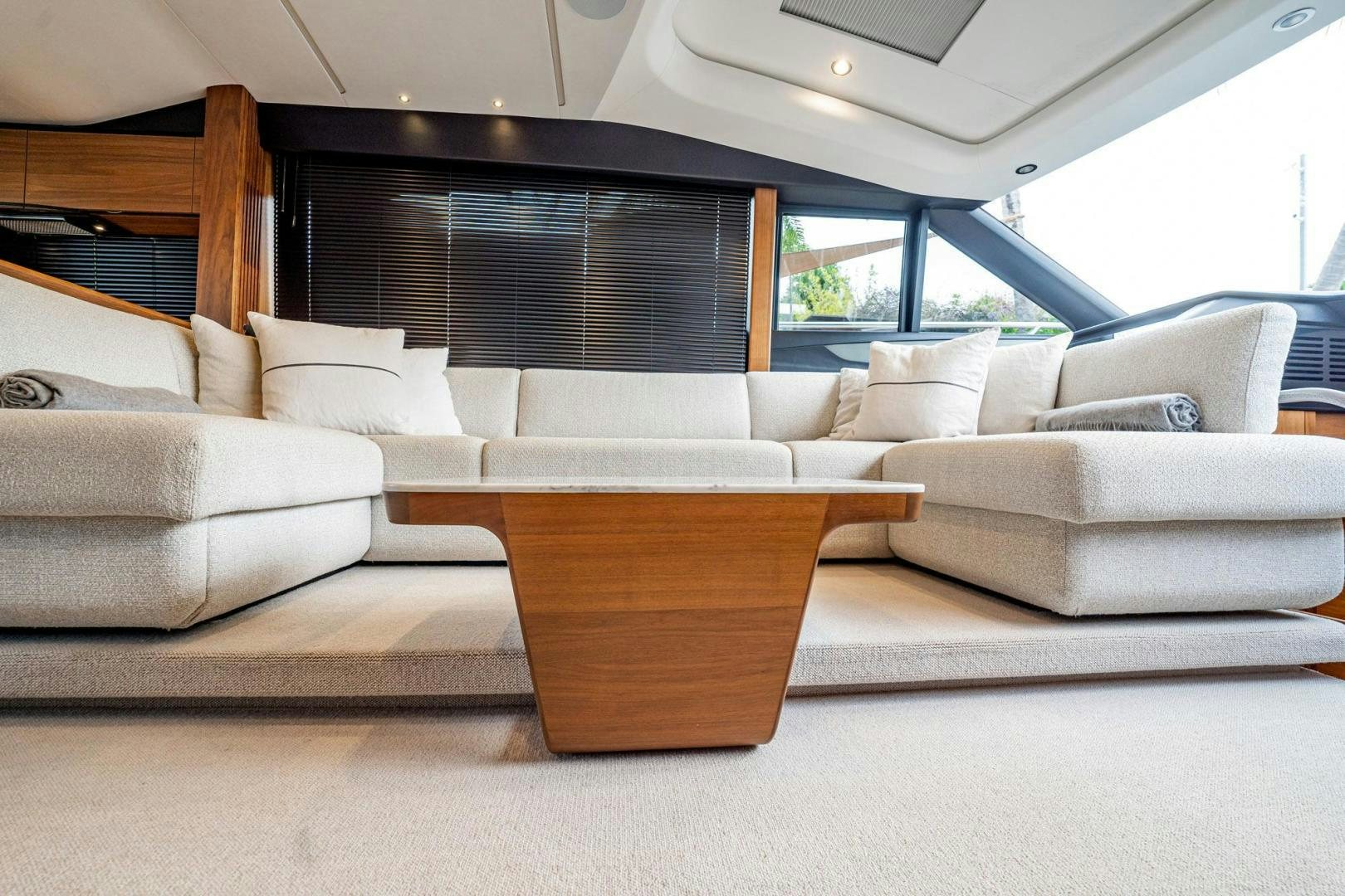 a living room with a large window aboard COCOON Yacht for Sale