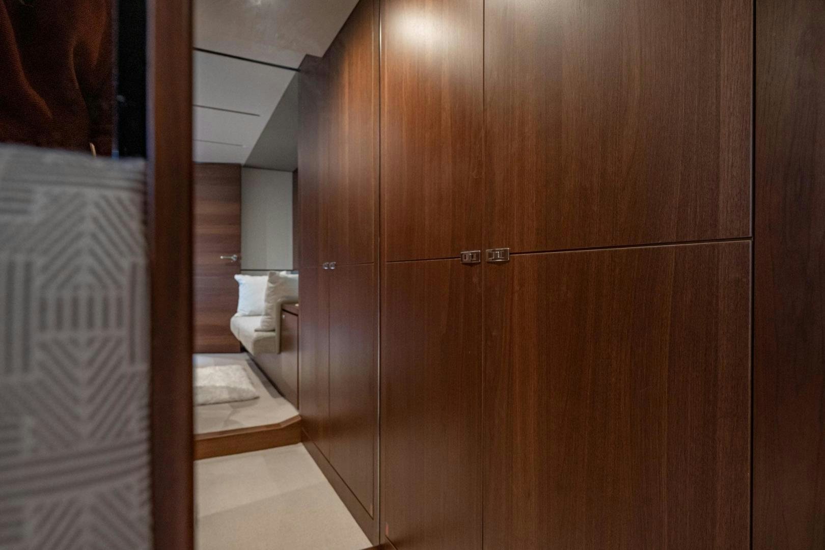 a bathroom with a wood cabinet aboard COCOON Yacht for Sale