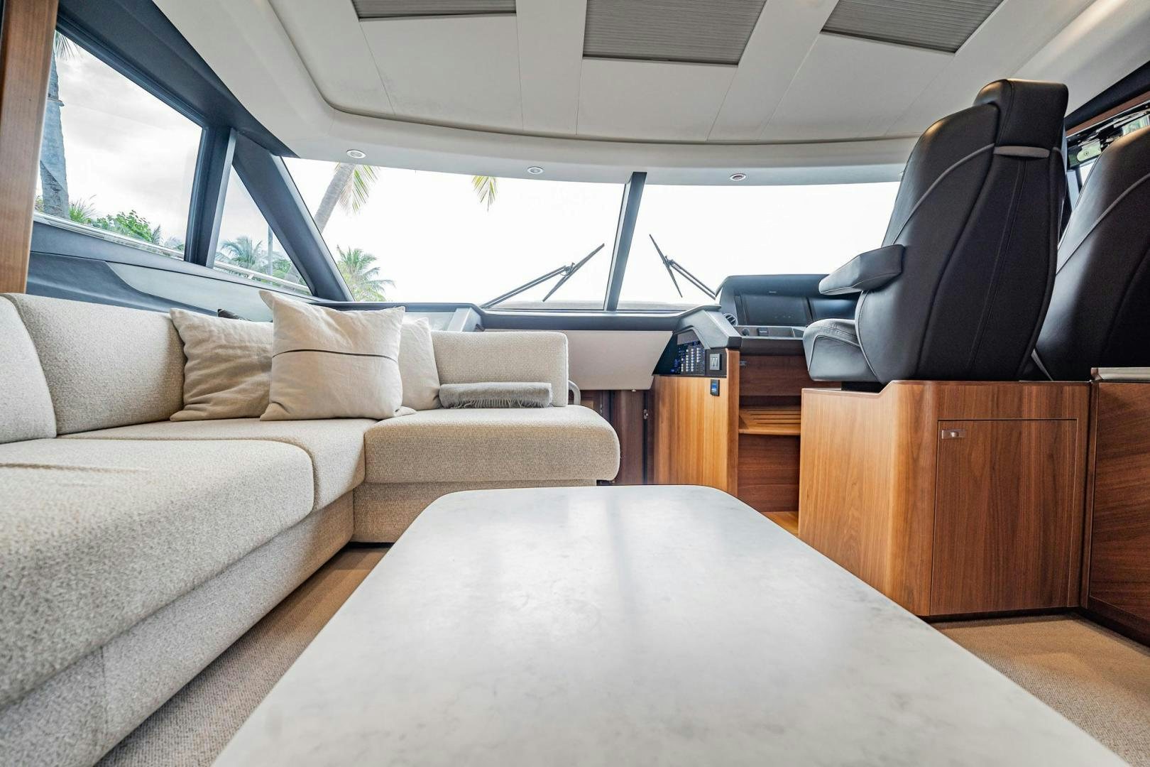 a room with a couch and a table aboard COCOON Yacht for Sale