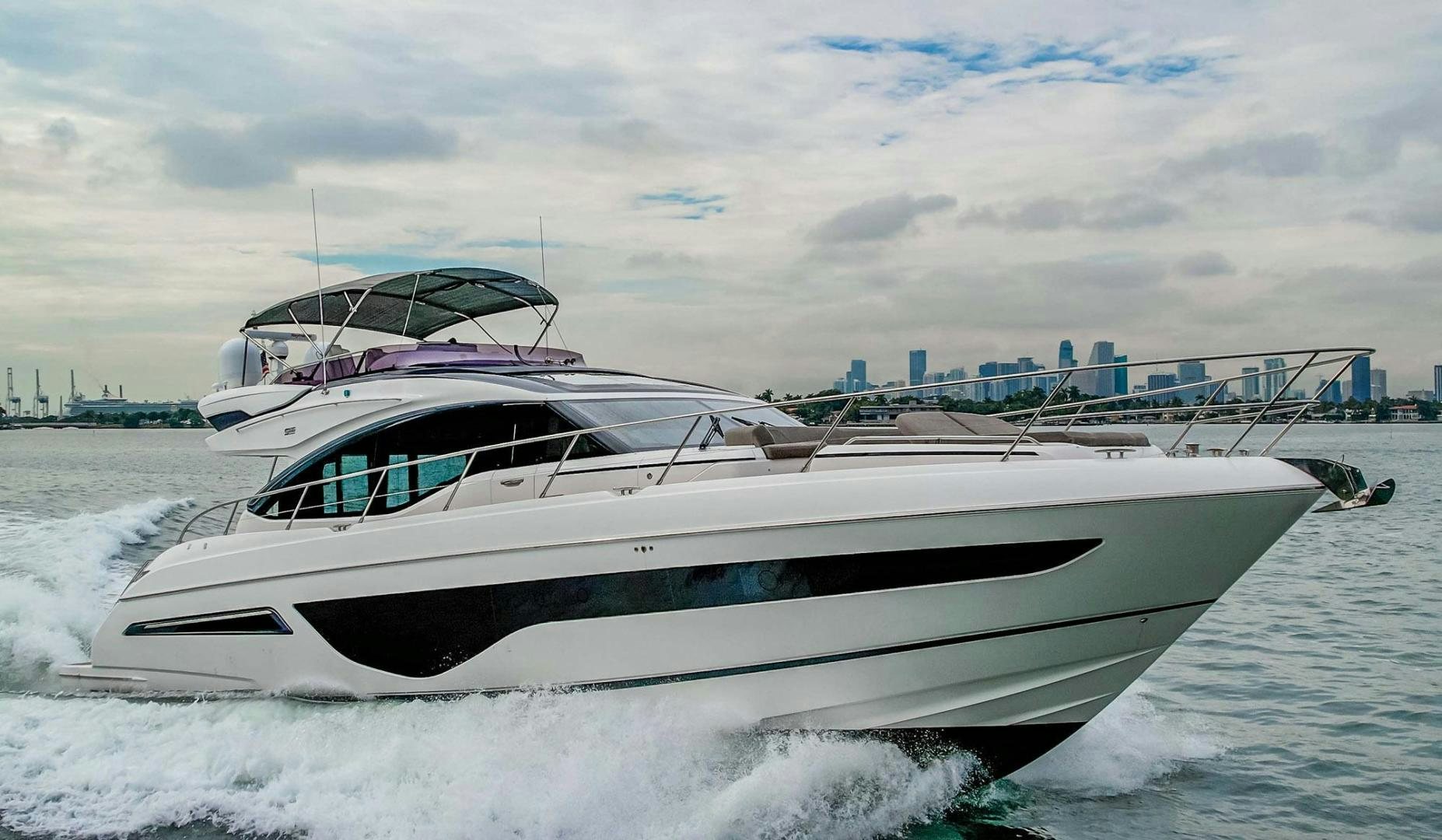 a white yacht on the water aboard COCOON Yacht for Sale