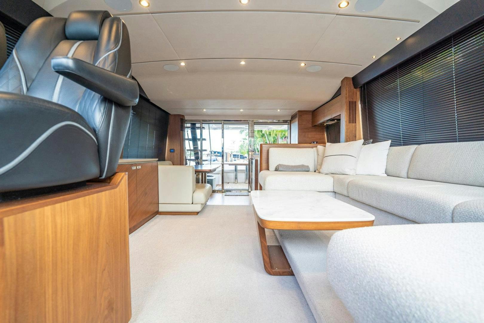 a living room with a couch and a table aboard COCOON Yacht for Sale