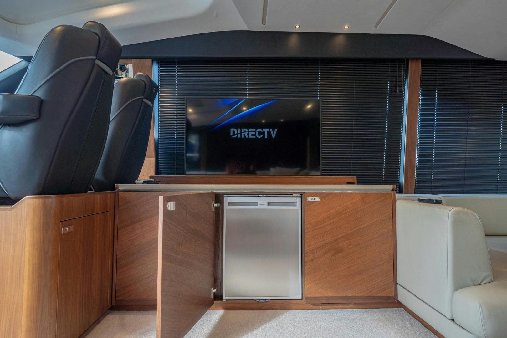 a tv on a desk aboard COCOON Yacht for Sale
