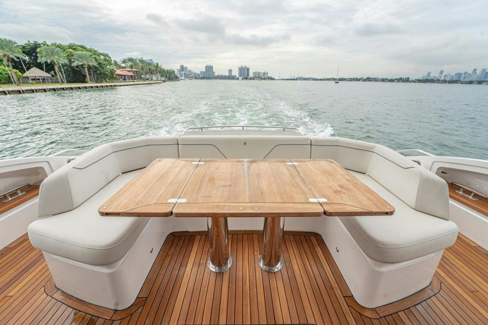 a wooden table on a boat aboard COCOON Yacht for Sale