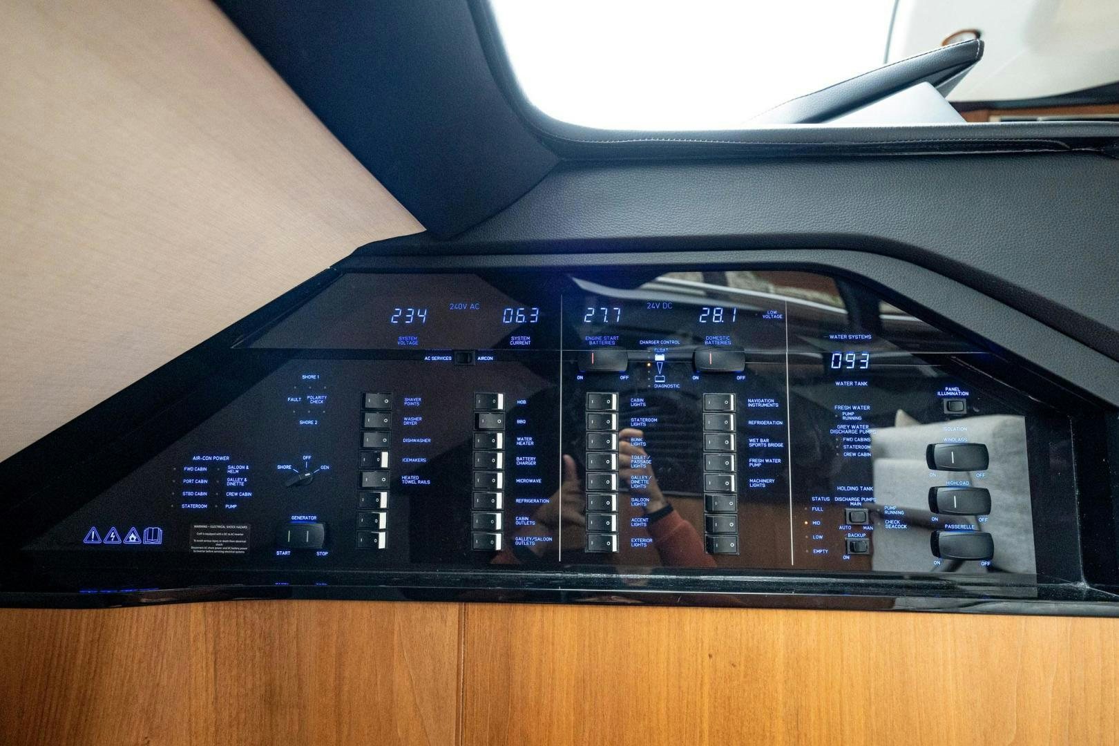 a black electronic device aboard COCOON Yacht for Sale