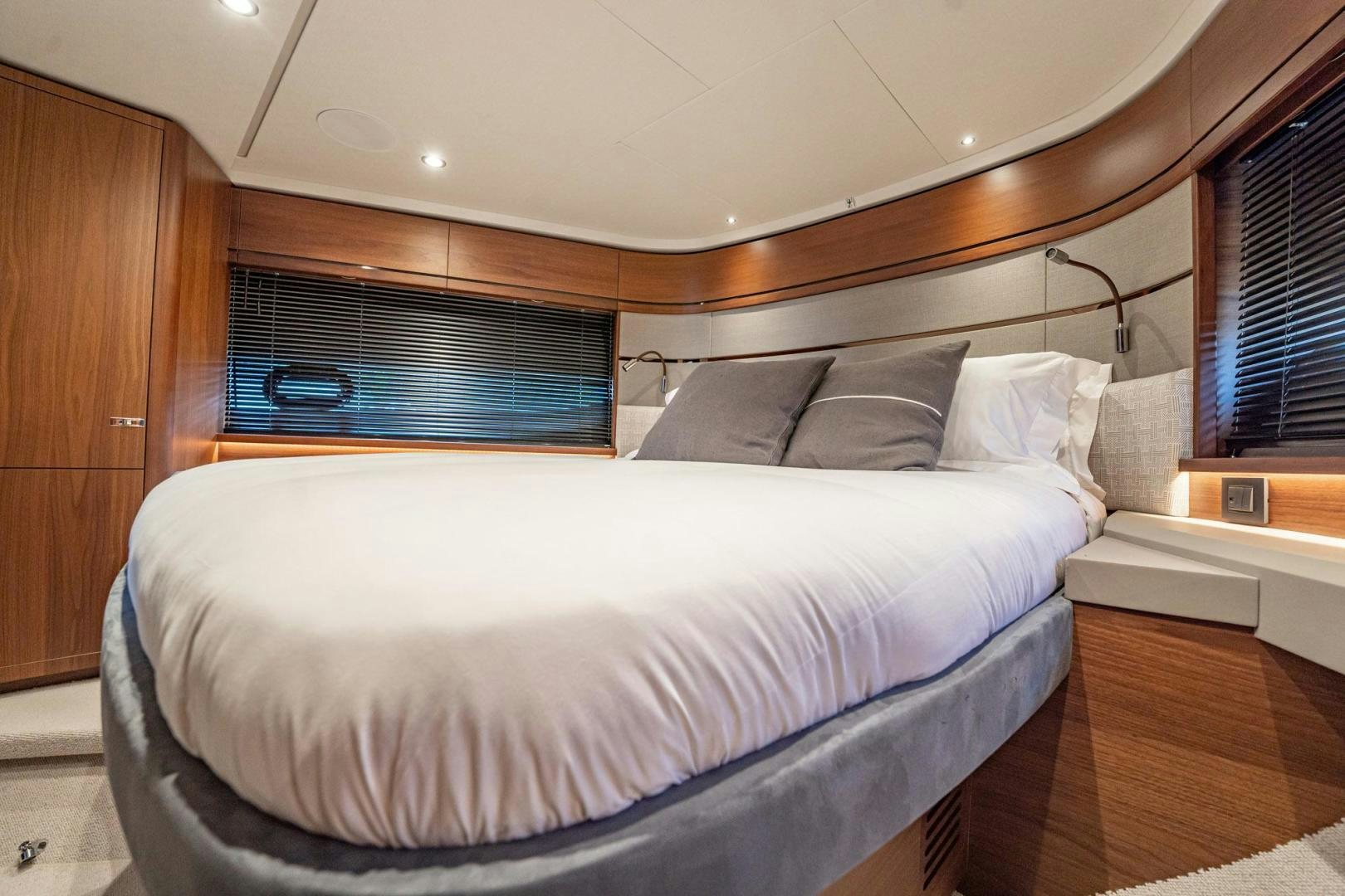 a bed with a white sheet aboard COCOON Yacht for Sale