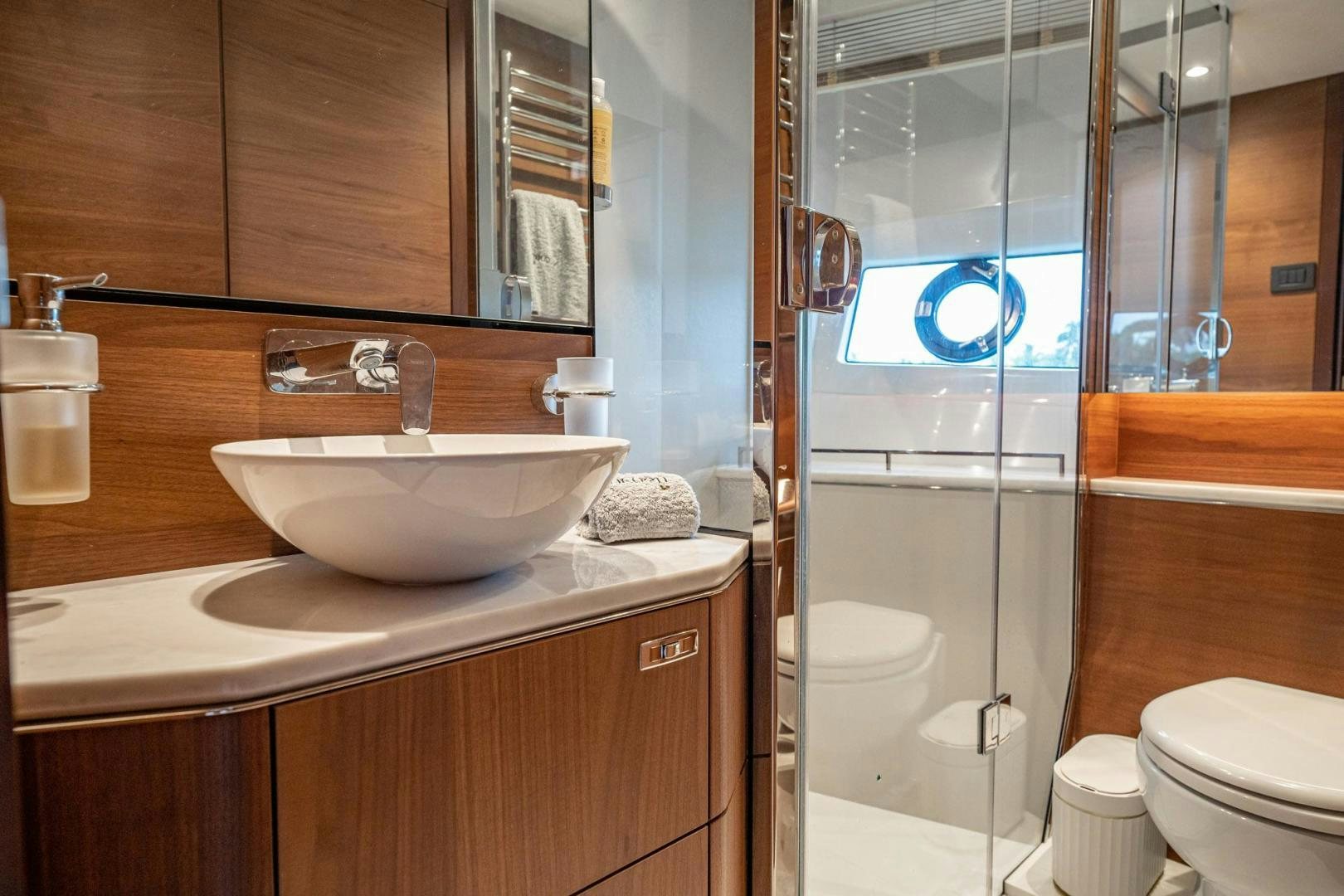 a bathroom with a sink and toilet aboard COCOON Yacht for Sale