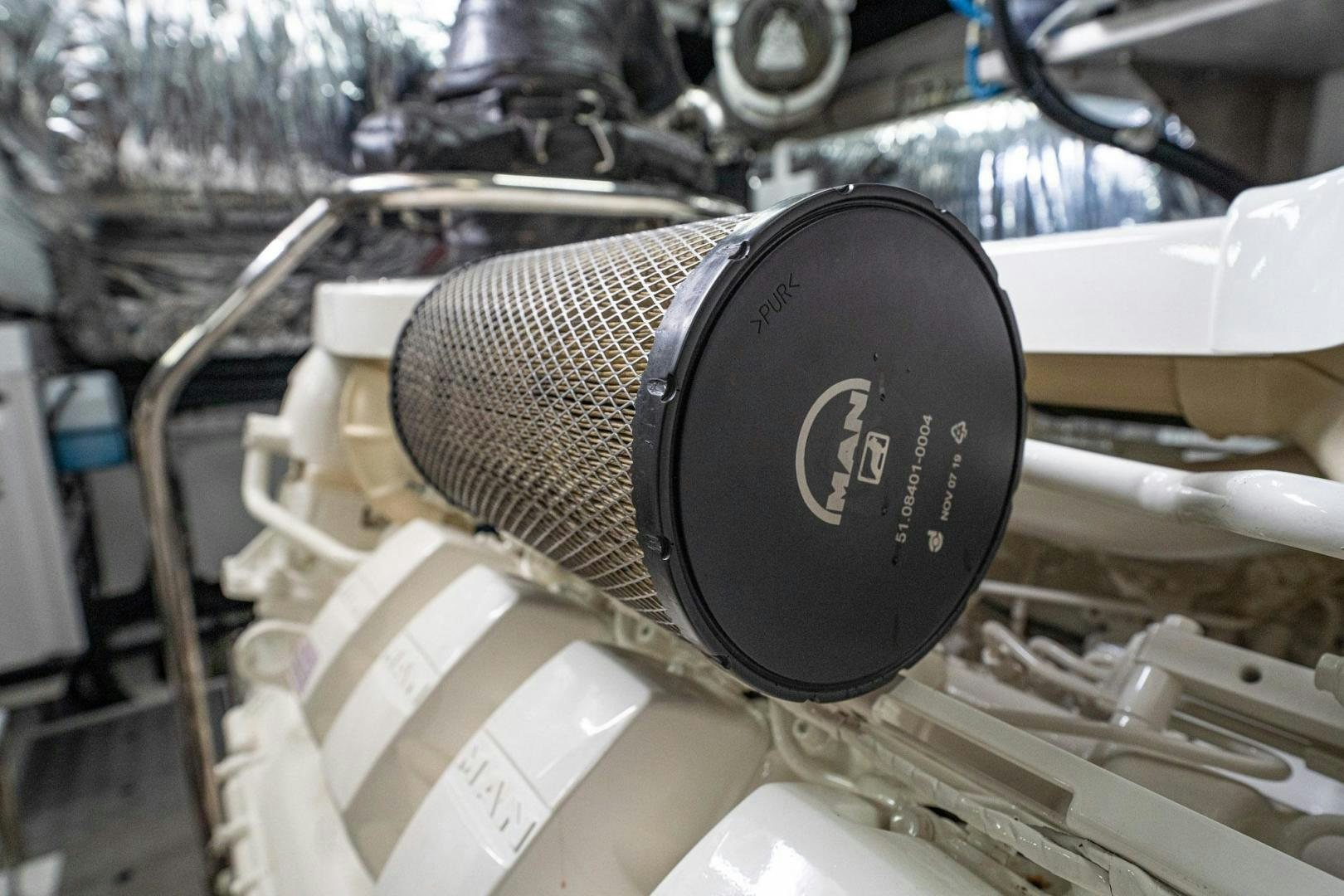 a black speaker on a white surface aboard COCOON Yacht for Sale