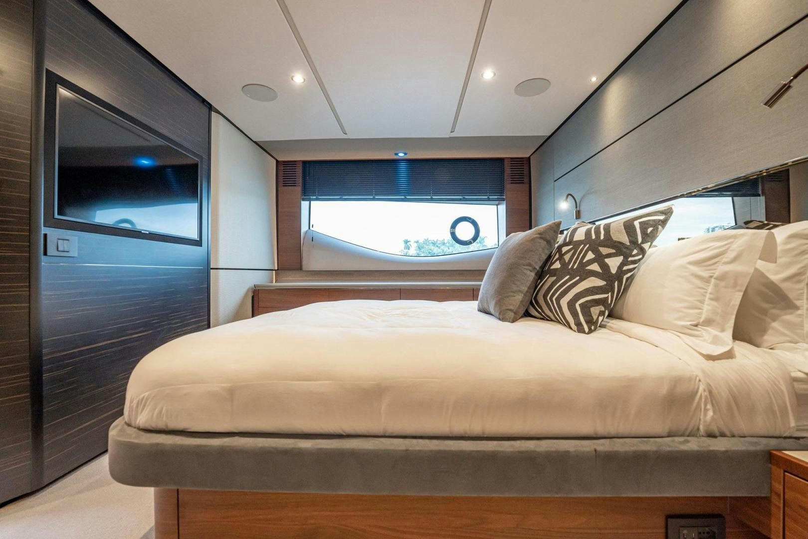 a bed with a large white bed aboard COCOON Yacht for Sale