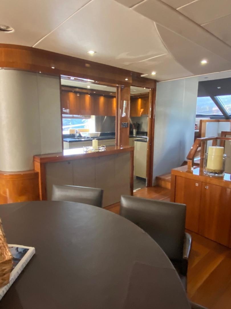 a large kitchen with a table aboard RIII Yacht for Sale