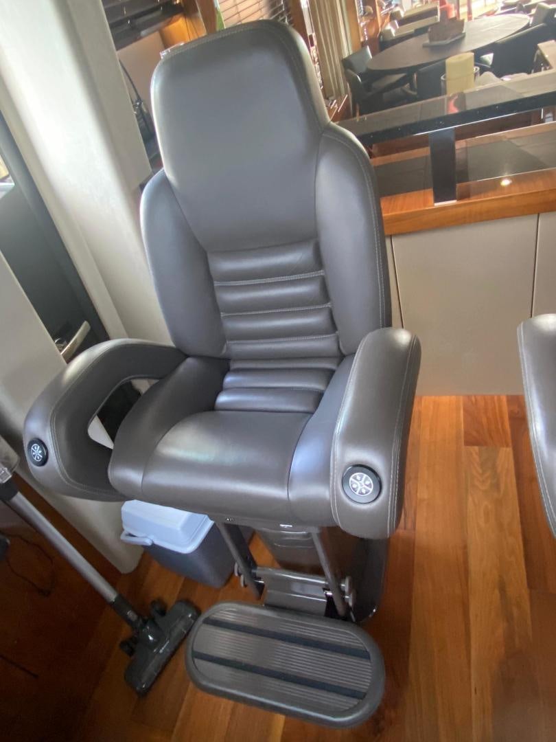 a chair in a room aboard RIII Yacht for Sale