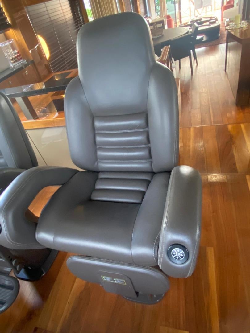 a chair in a room aboard RIII Yacht for Sale