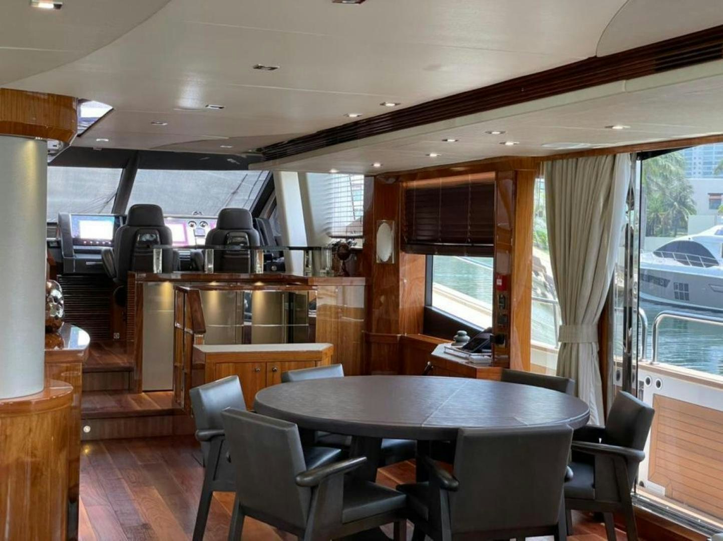 a room with a table and chairs aboard RIII Yacht for Sale