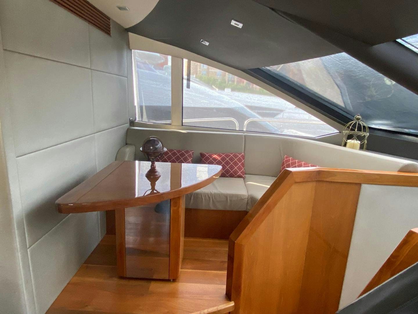 a room with a table and a window aboard RIII Yacht for Sale