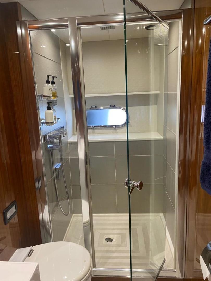 a shower unit with a glass door aboard RIII Yacht for Sale
