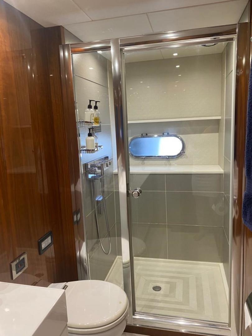a shower unit with a glass door aboard RIII Yacht for Sale