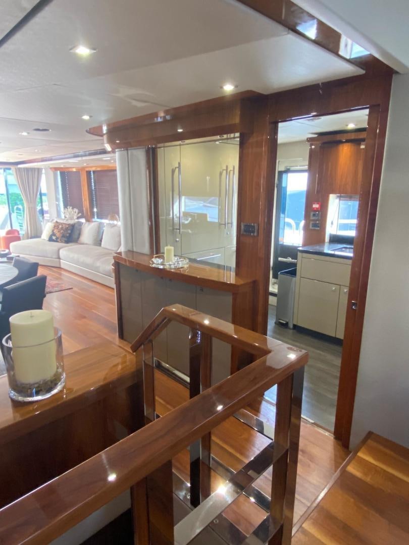 a table and chairs in a room aboard RIII Yacht for Sale