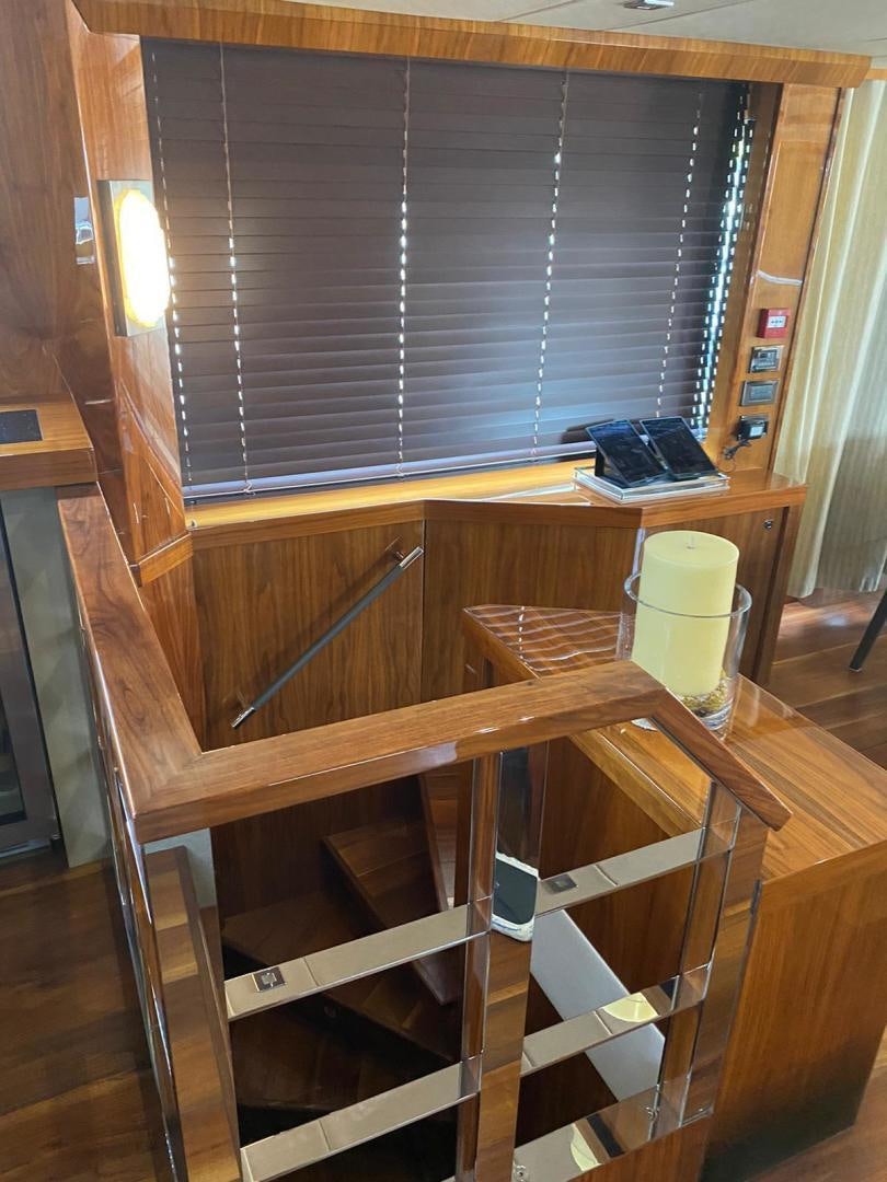 a wooden shelf with a laptop on it aboard RIII Yacht for Sale