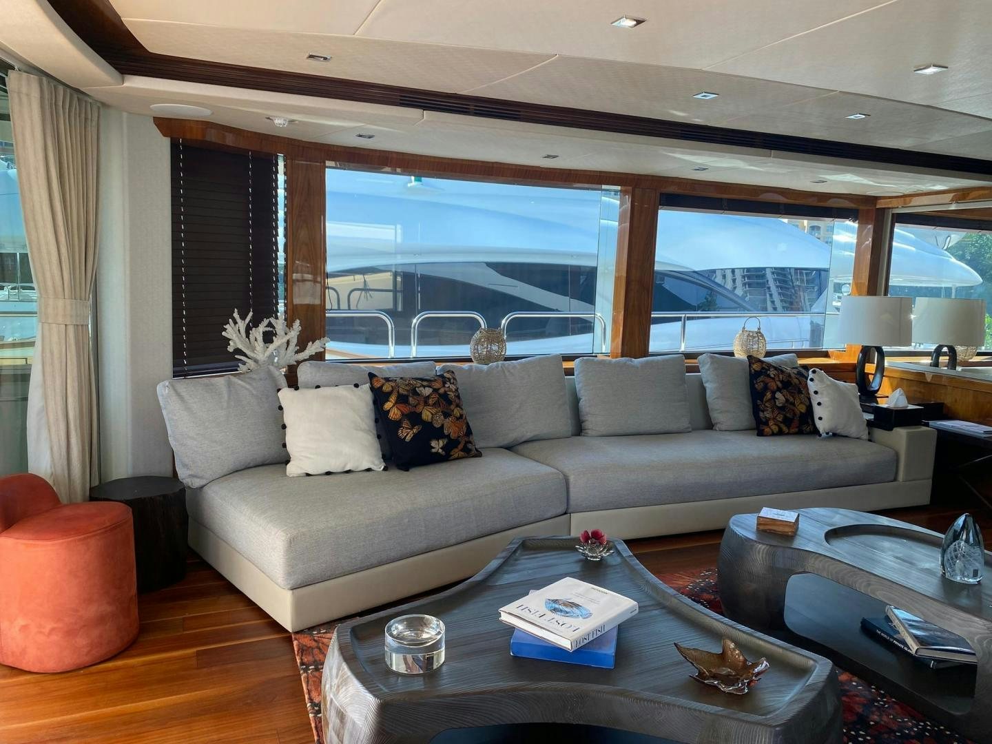 a living room with a large window aboard RIII Yacht for Sale