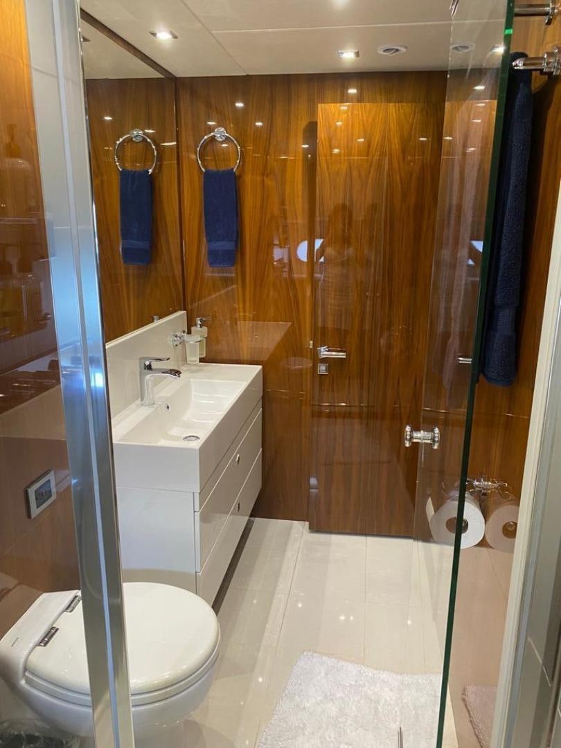 a bathroom with a shower and sink aboard RIII Yacht for Sale