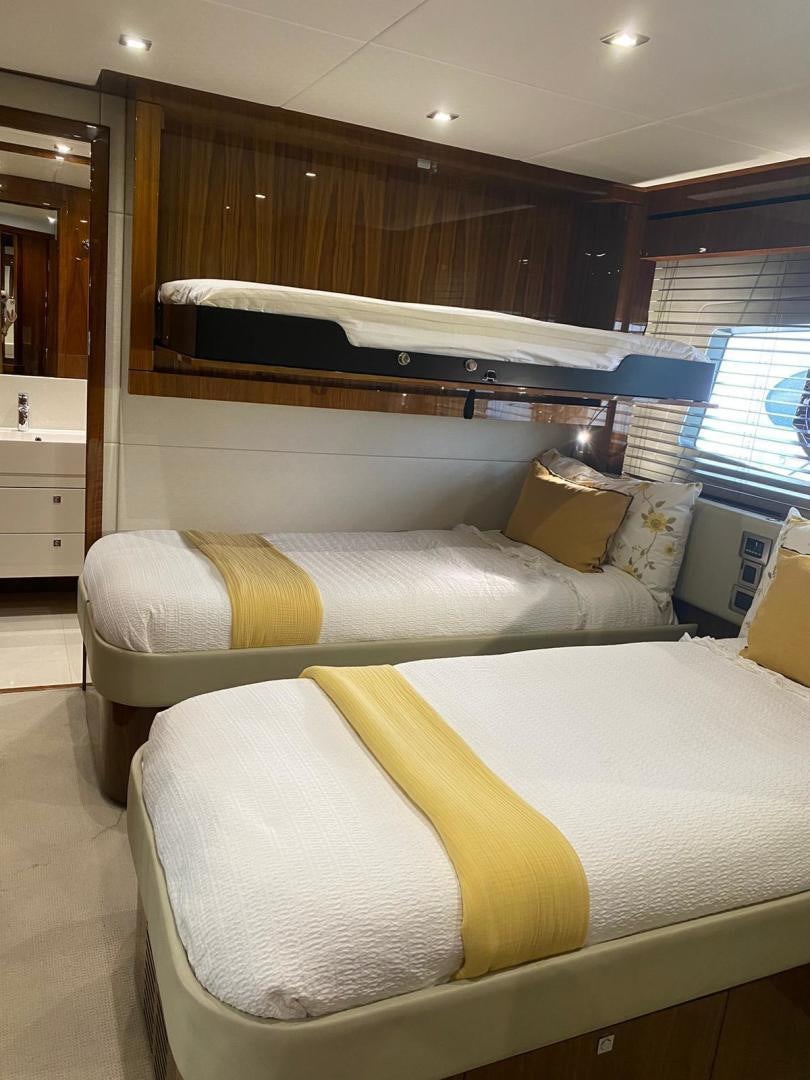 a bed in a room aboard RIII Yacht for Sale