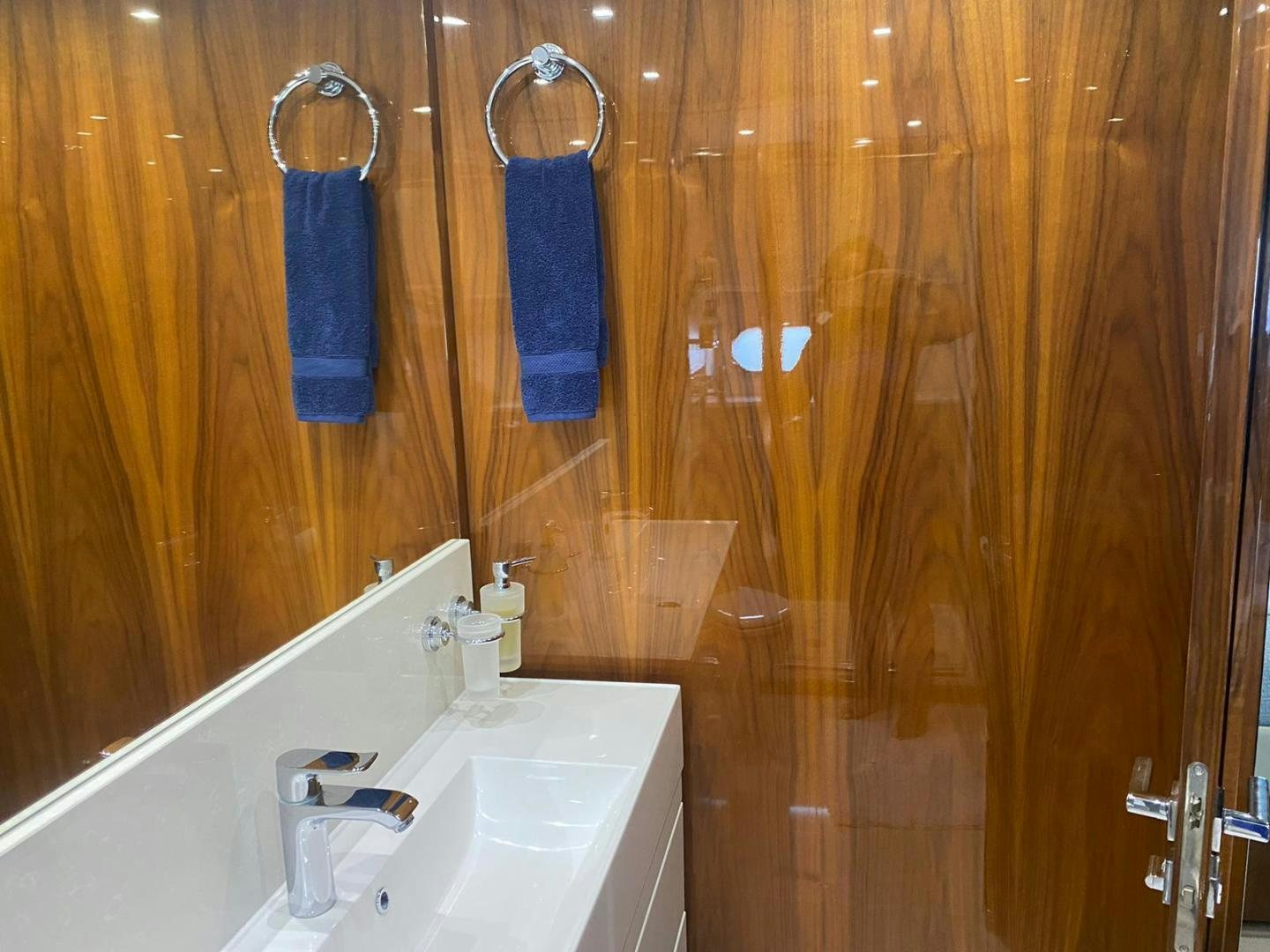 a bathroom with wooden walls aboard RIII Yacht for Sale