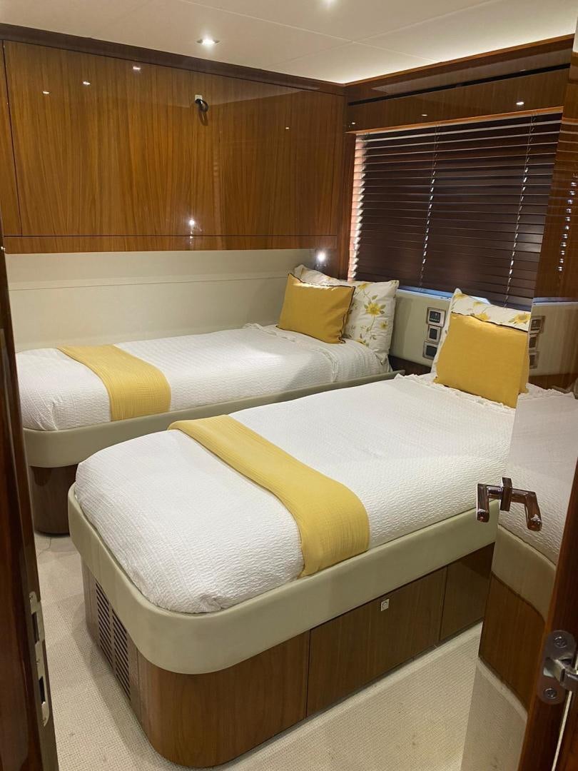 a room with two beds aboard RIII Yacht for Sale
