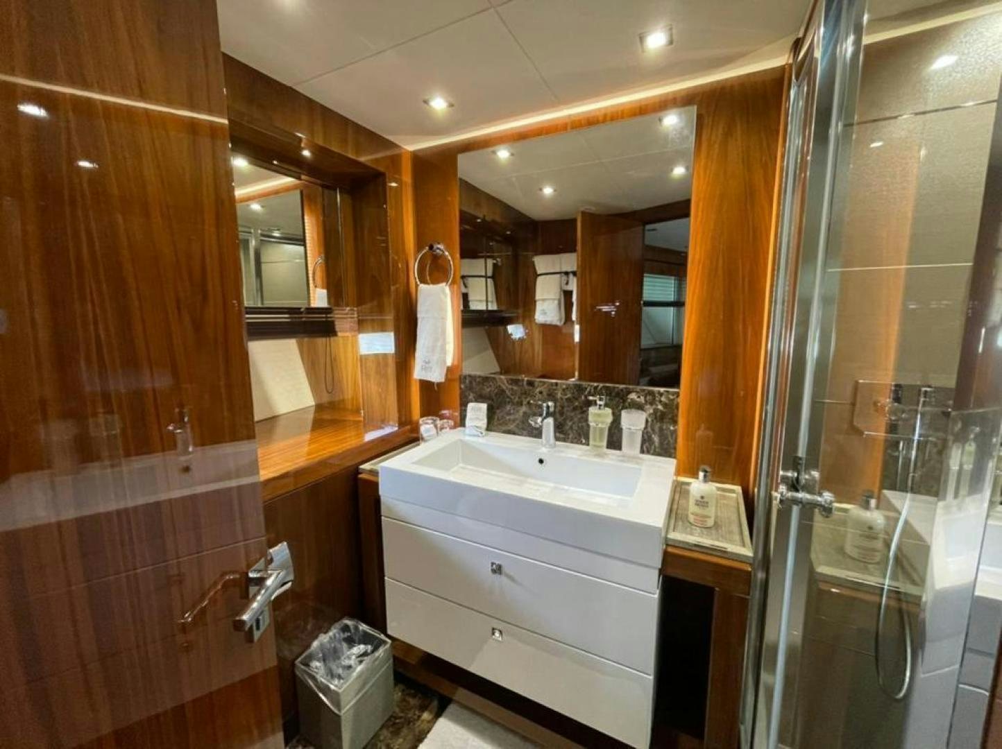 a bathroom with a large mirror aboard RIII Yacht for Sale