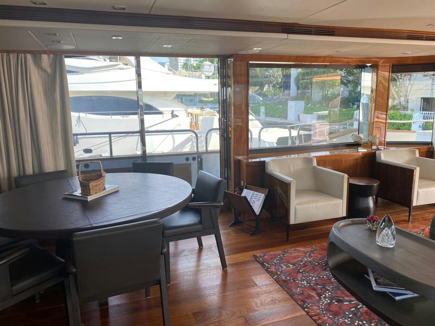 a room with a table and chairs aboard RIII Yacht for Sale