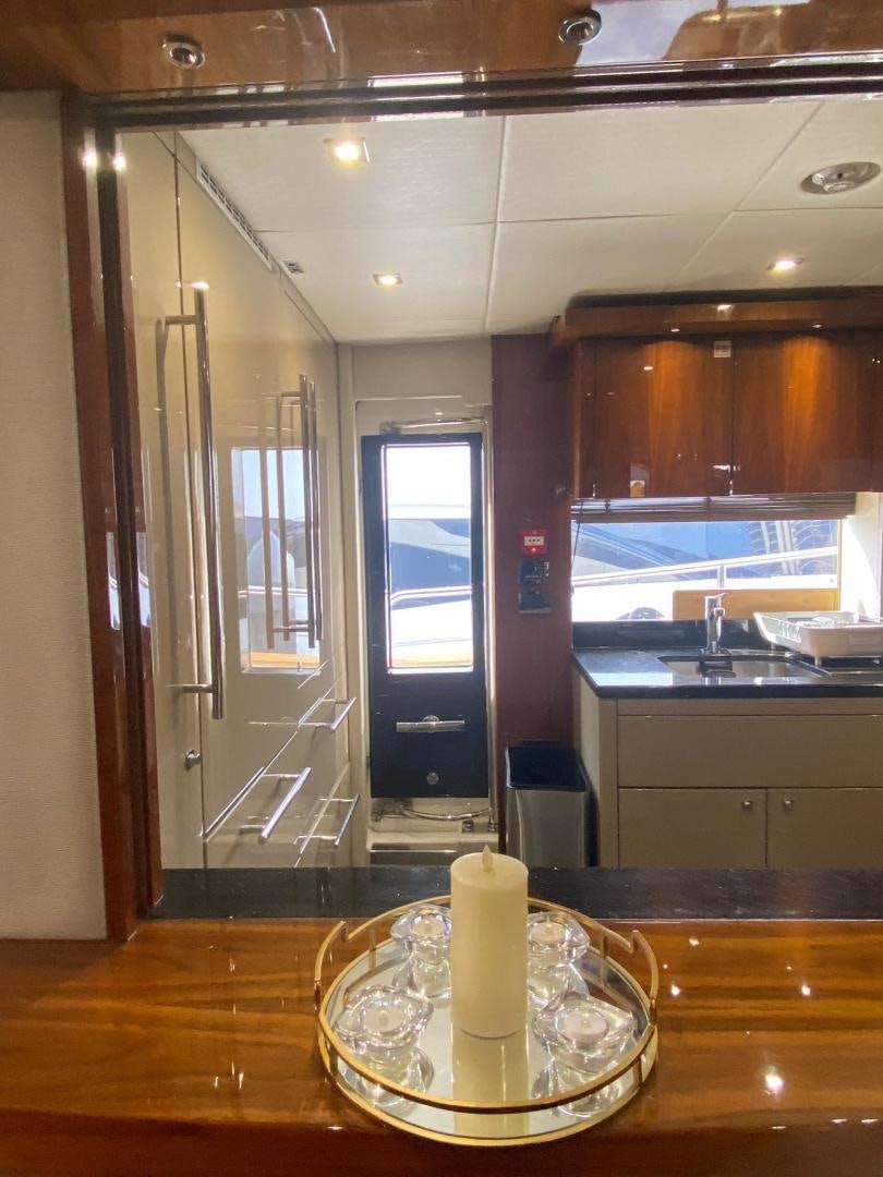 a candle on a table aboard RIII Yacht for Sale