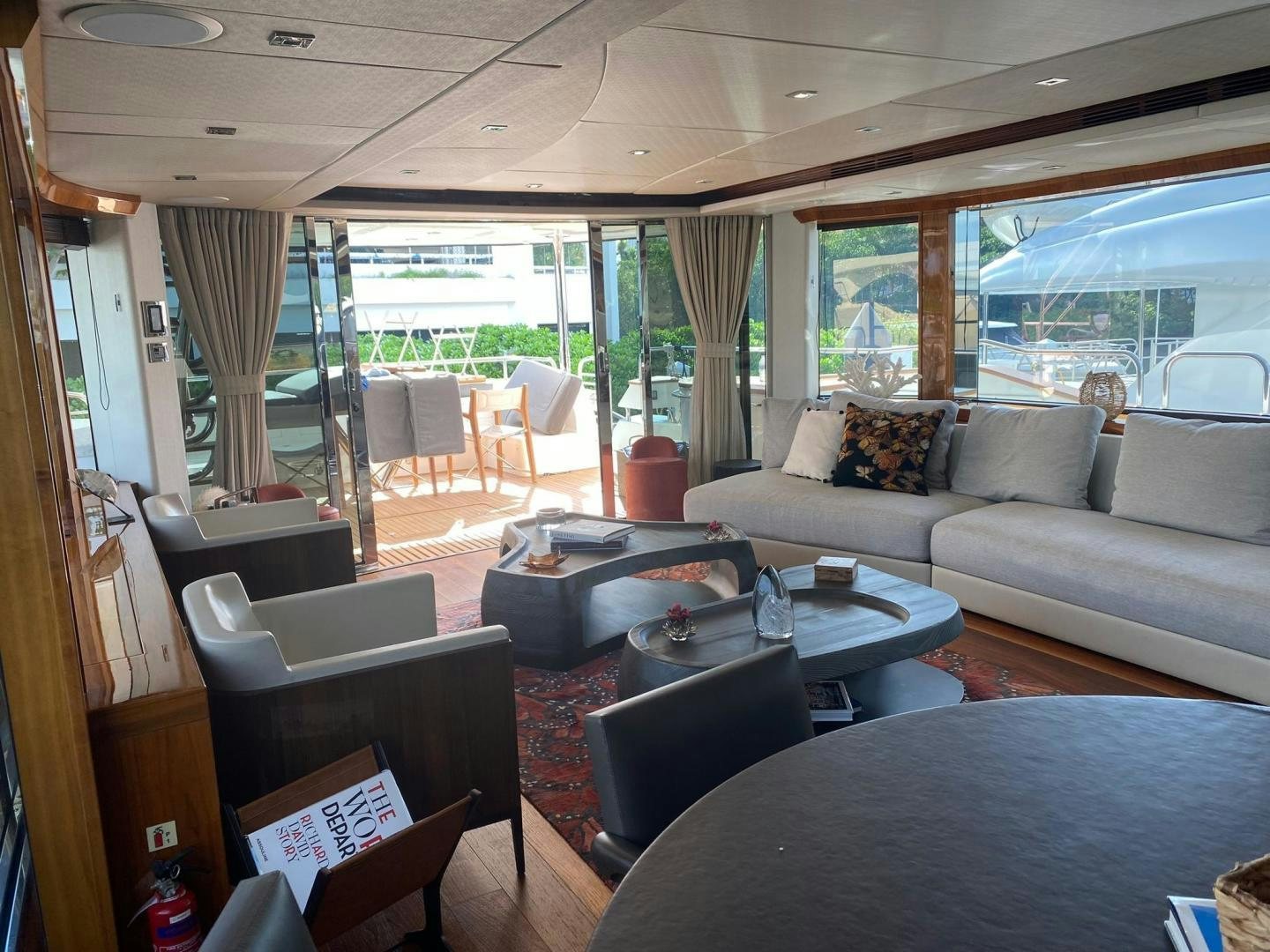 a living room with a couch and a table aboard RIII Yacht for Sale