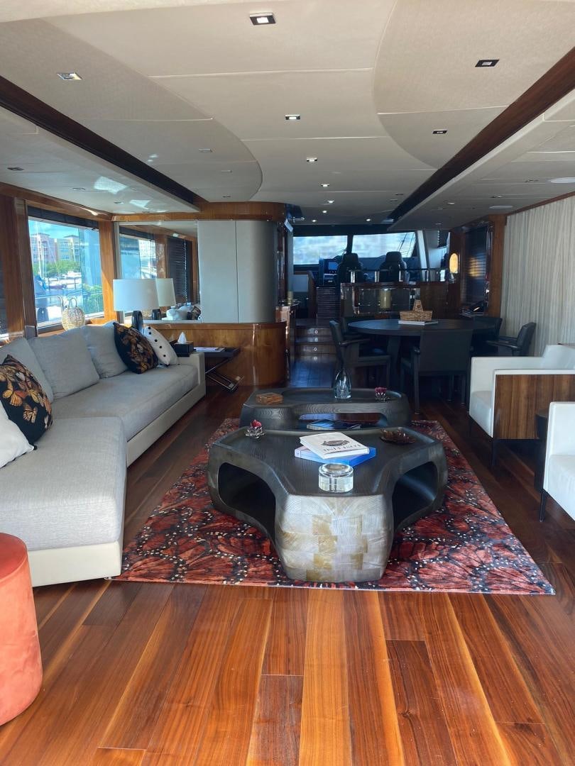 a living room with a couch and a coffee table aboard RIII Yacht for Sale