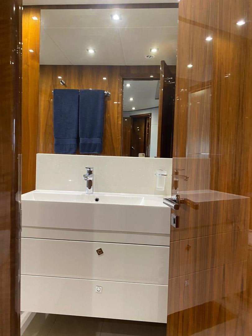 a bathroom with a sink and a mirror aboard RIII Yacht for Sale