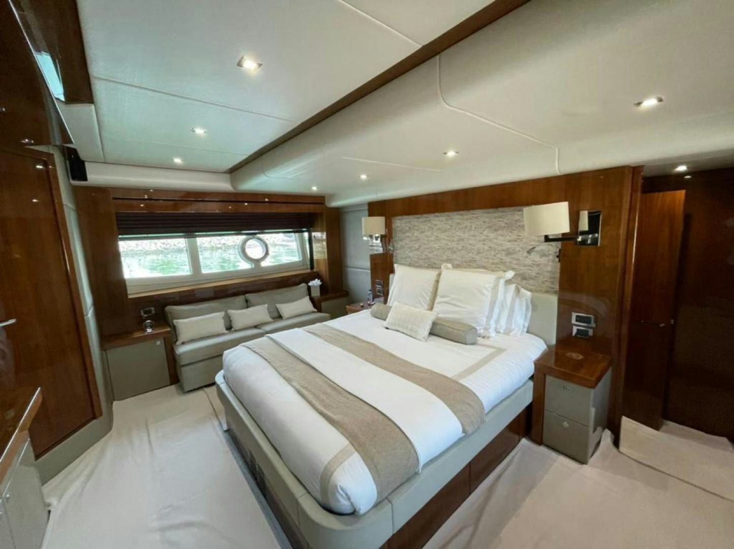 a room with a bed and a window aboard RIII Yacht for Sale