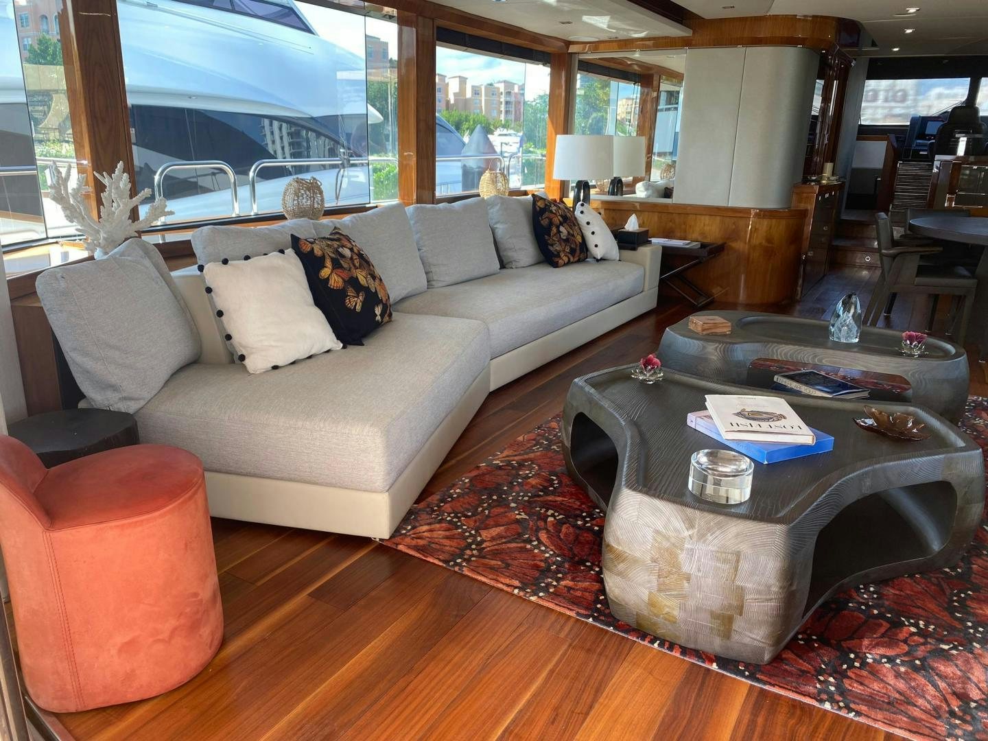 a living room with a couch and a coffee table aboard RIII Yacht for Sale