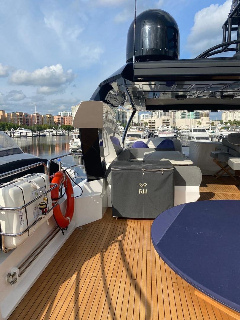 a boat with a helmet on the deck aboard RIII Yacht for Sale