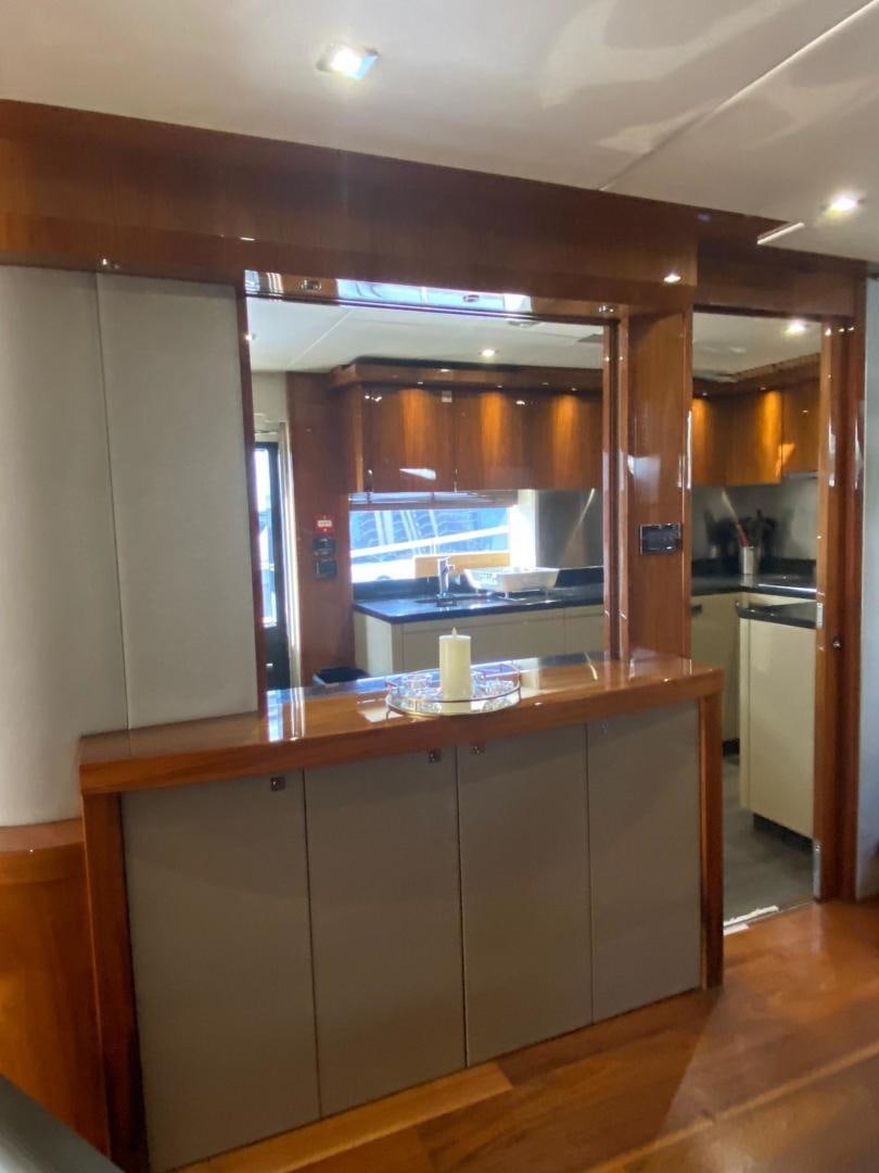 a kitchen with a large window aboard RIII Yacht for Sale