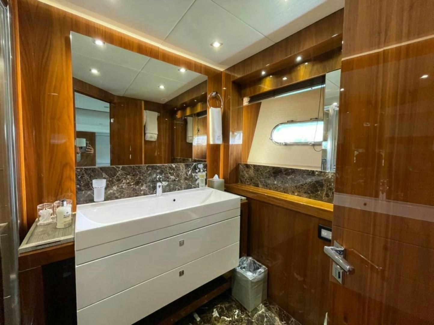 a bathroom with a large mirror aboard RIII Yacht for Sale