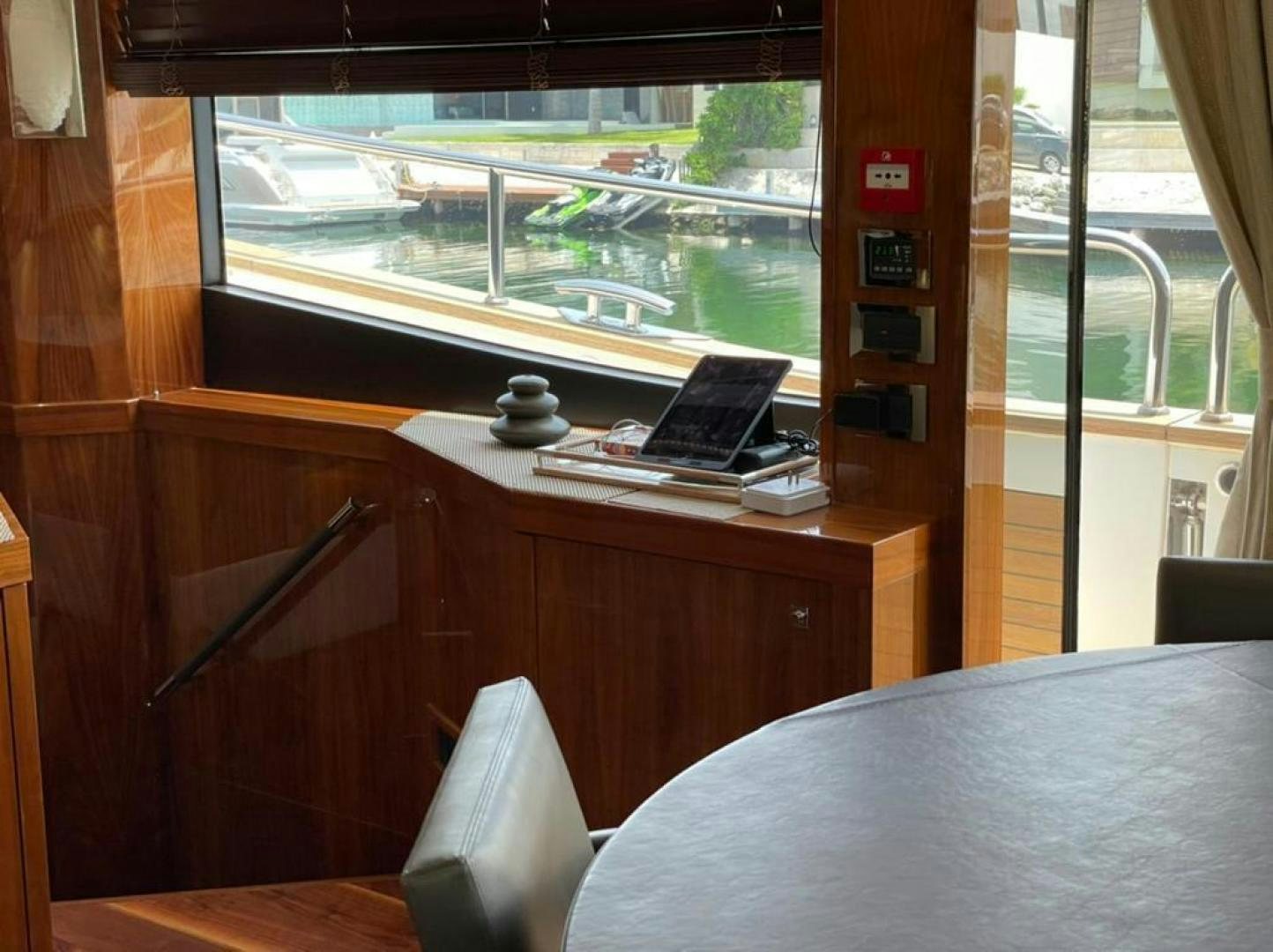a laptop on a table aboard RIII Yacht for Sale