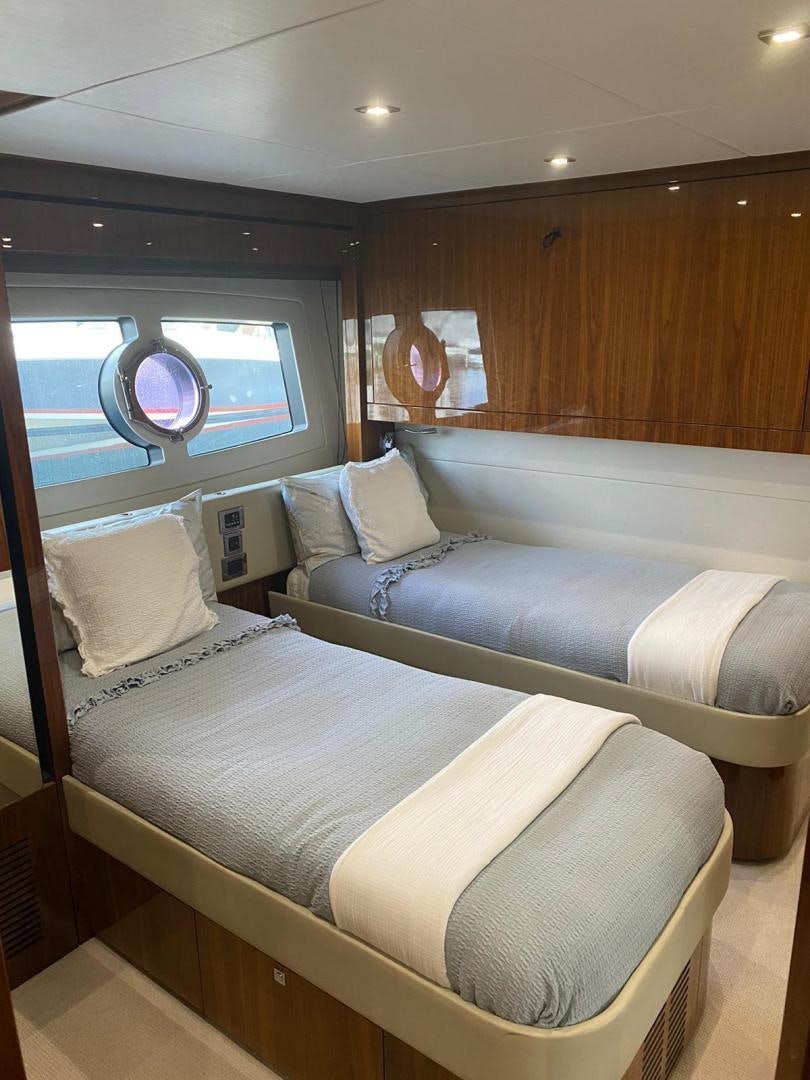 a room with a bed and a window aboard RIII Yacht for Sale