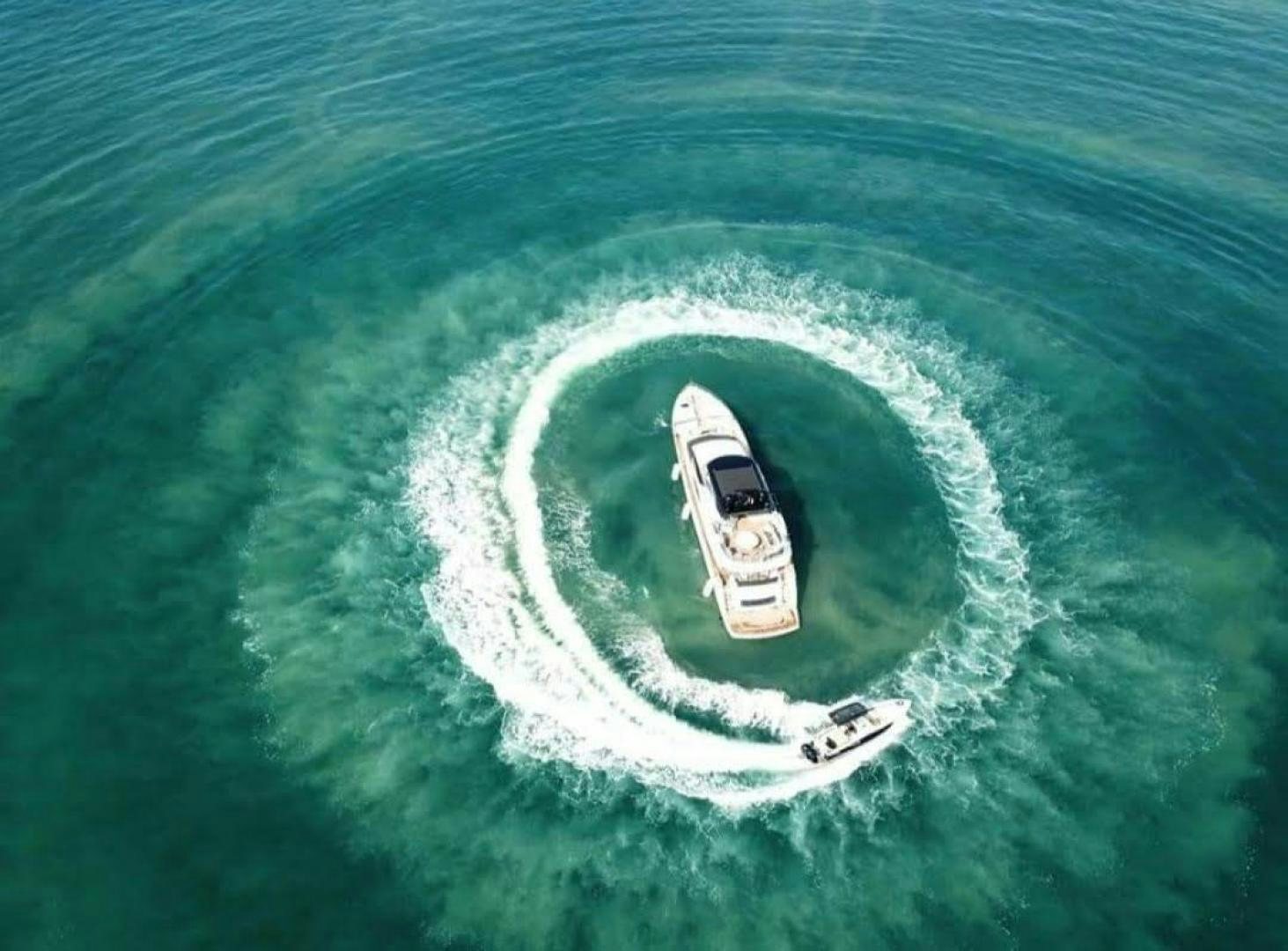 a white car on a wave aboard RIII Yacht for Sale