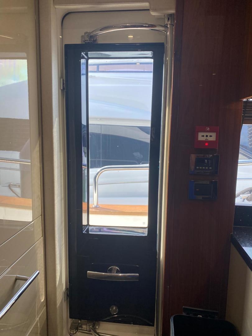 a door with a screen aboard RIII Yacht for Sale