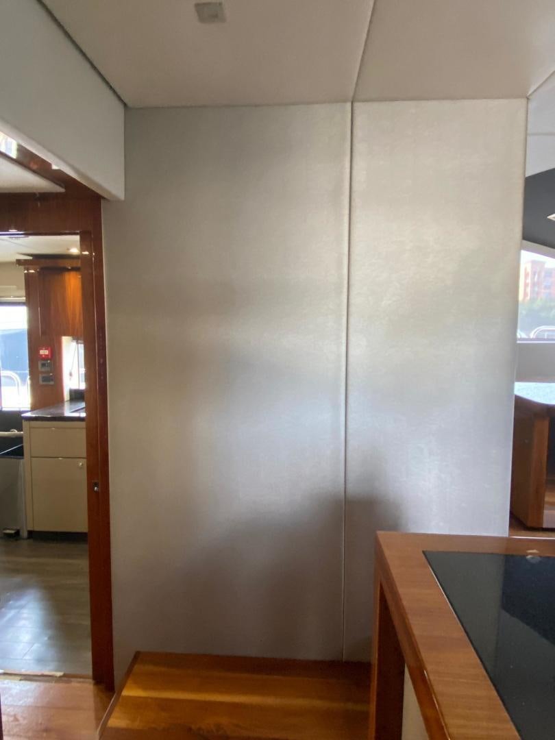 a room with a table and a door aboard RIII Yacht for Sale