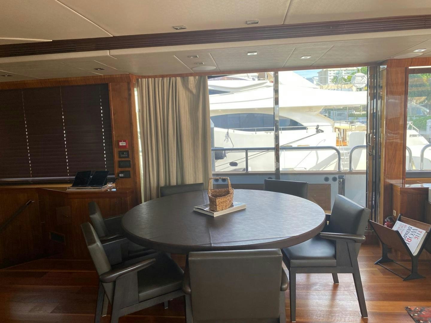a table with chairs around it aboard RIII Yacht for Sale