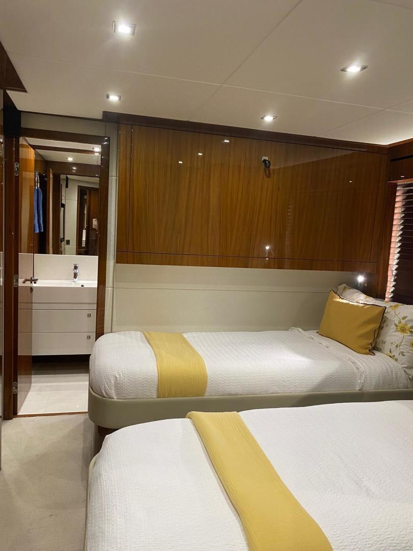 a room with two beds aboard RIII Yacht for Sale