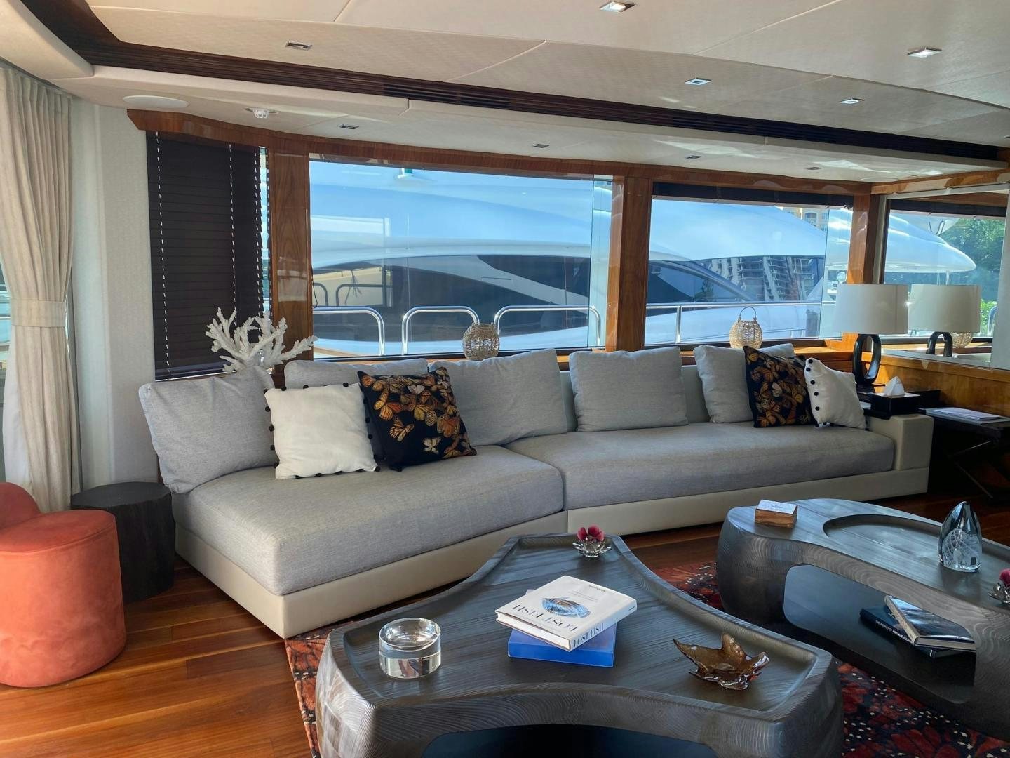 a living room with a large window aboard RIII Yacht for Sale