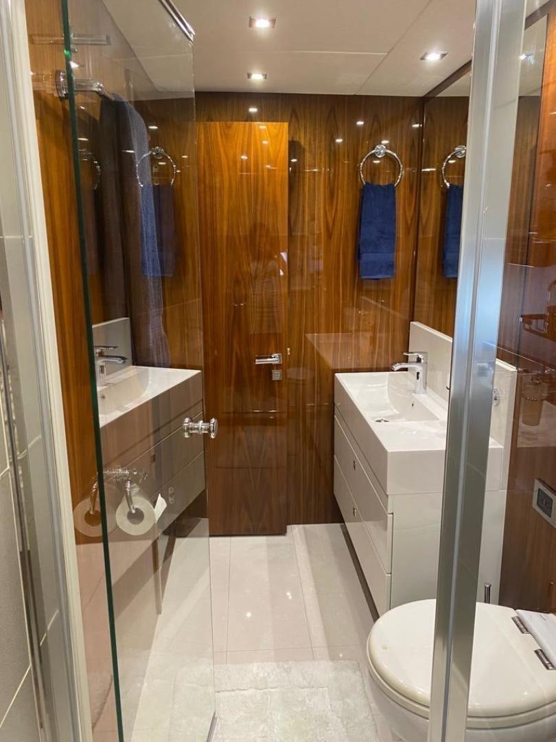 a bathroom with a standup shower aboard RIII Yacht for Sale