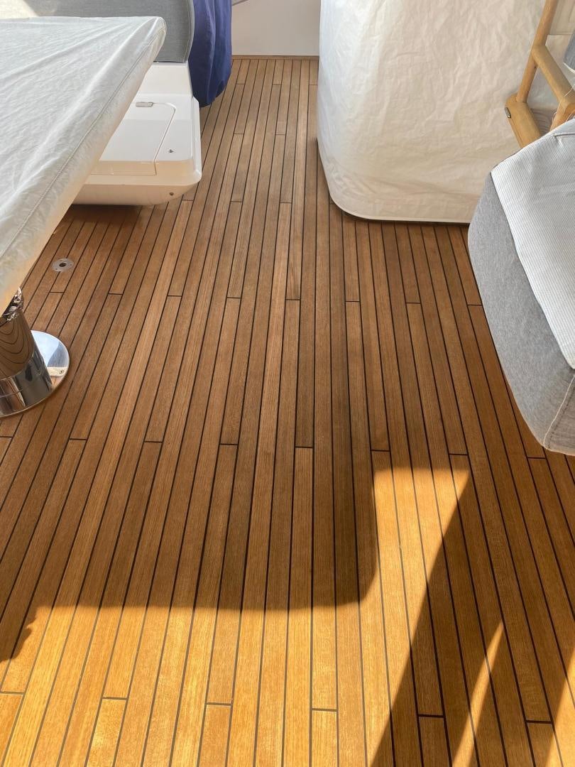 a wooden floor with a white pillow aboard RIII Yacht for Sale