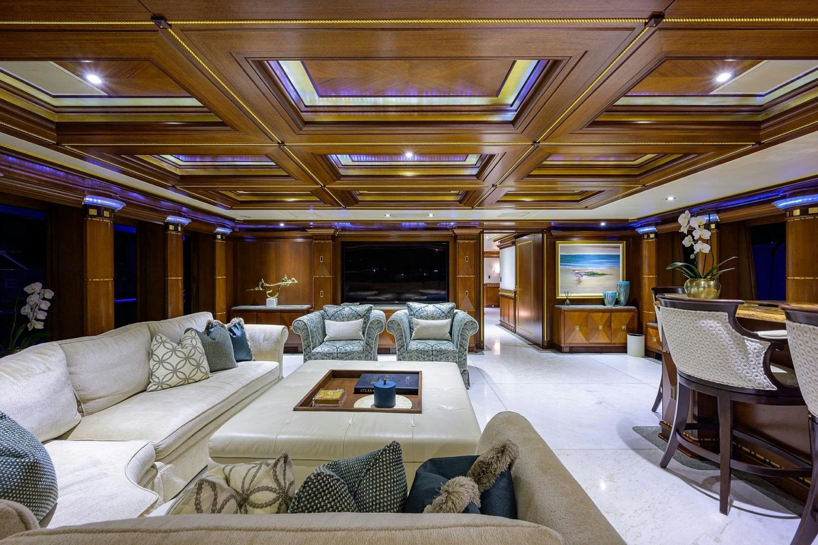 a living room with a couch and a table aboard STARSHIP Yacht for Sale