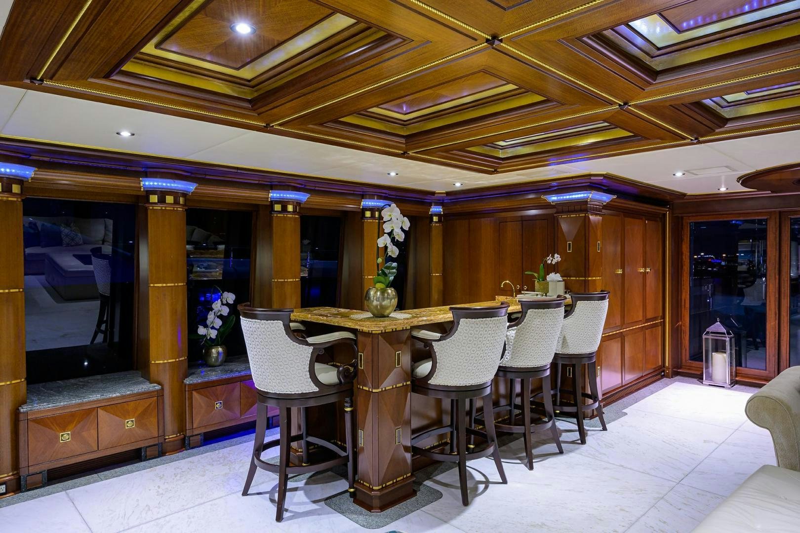 a room with a table and chairs aboard STARSHIP Yacht for Sale