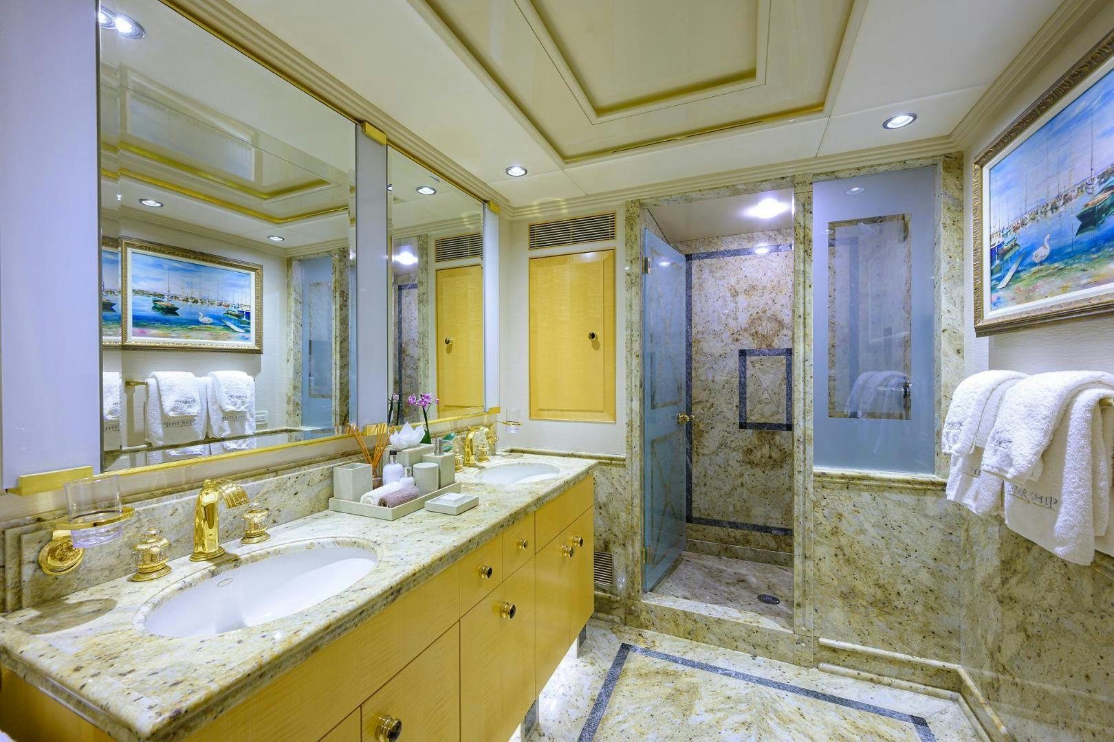 a bathroom with a large mirror aboard STARSHIP Yacht for Sale